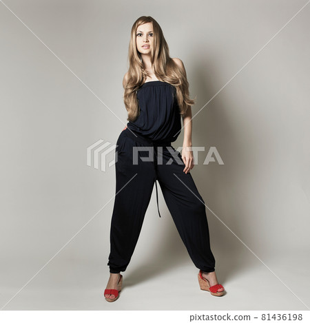 Portrait of charming dancing girl. Beautiful lady on gray background Portrait of charming dancing girl. Beautiful lady on gray background 81436198