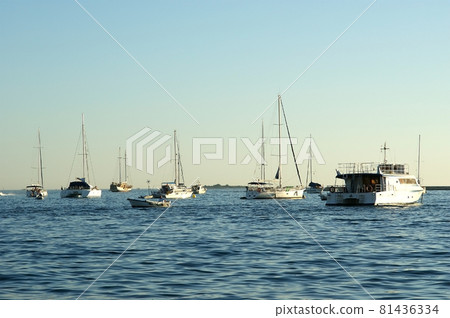 View of the sea and a yacht in sunset time View of the sea and a yacht in sunset time 81436334