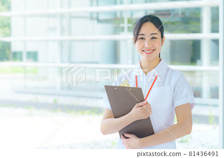Smiling medical worker in white coat working in hospital Smiling medical worker in white coat working in hospital 81436491