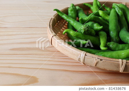 Sweet and long nanban on a bamboo basket on a wood background Sweet and long nanban on a bamboo basket on a wood background 81438676