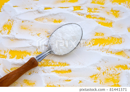 Baking soda on yellow background. Baking soda on yellow background. 81441371