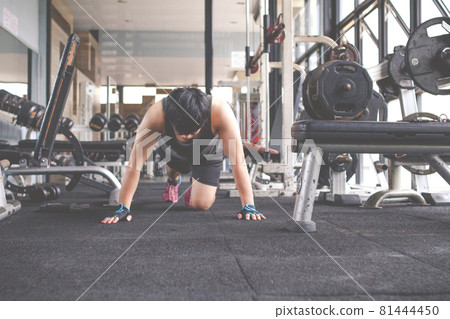 Sport man doing push ups exercise in gym. Workout concept. Fitness concept 81444450