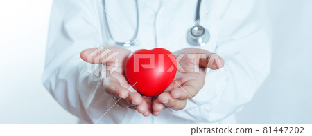 Red heart in hand doctor women. cardiology symbol. treatment and healthcare concept. 81447202
