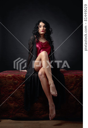 Young beautiful woman with long curly hair in lingerie. 81449029