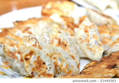Lots of baked dumplings Lots of baked dumplings 81449363