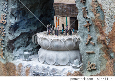 NEW TAIPEI CITY, TAIWAN - JANUARY 27, 2012: Incense sticks burning inside the pot at Guan Dao Guan Ying Buddhist Temple NEW TAIPEI CITY, TAIWAN - JANUARY 27, 2012: Incense sticks burning inside the pot at Guan Dao Guan Ying Buddhist Temple 81451102