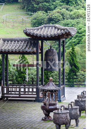 NEW TAIPEI CITY, TAIWAN - JANUARY 27, 2012:  Buddhist ringing bell at Guan Dao Guan Ying Temple 81451126