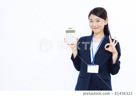 Business woman in her thirties with a calculator Business woman in her thirties with a calculator 81456321