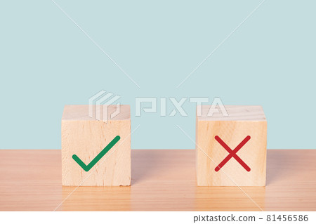 True and false symbols accepted rejected on wood cubes. True and false symbols accepted rejected on wood cubes. 81456586