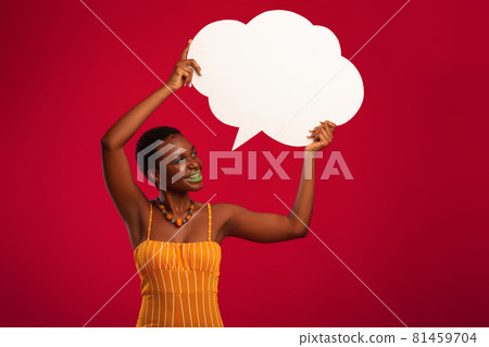 Stylish black woman looking at empty speech bubble 81459704