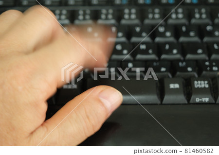 The movement of the finger hitting the keyboard Business image 81460582