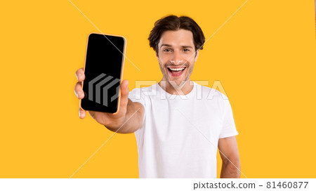 Man showing white blank smartphone screen close to camera 81460877