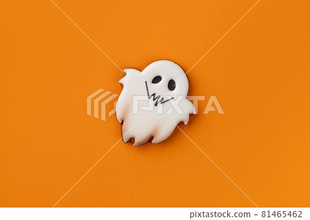 Halloween homemade gingerbread on orange background with copy space Halloween homemade gingerbread on orange background with copy space 81465462
