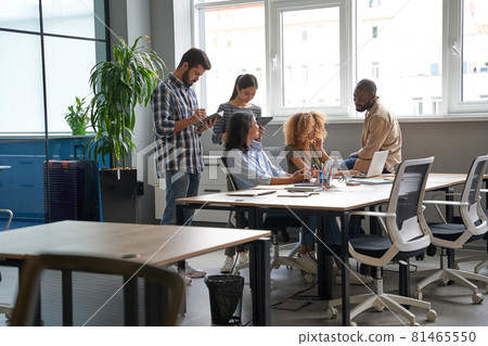 Workers doing brainstorm together in conference room Workers doing brainstorm together in conference room 81465550