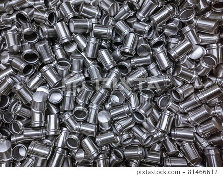 Shiny cold deformated cylindrical steel parts flat background 81466612