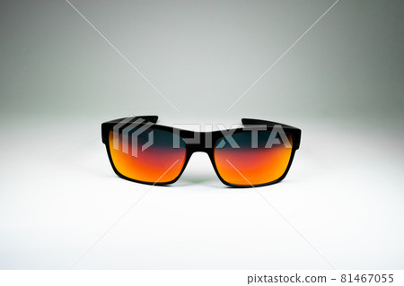 Product photo of sun Glasses with orange glass and black frame on white background. Template for social media, website Product photo of sun Glasses with orange glass and black frame on white background. Template for social media, website 81467055