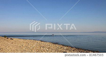 Panorama of Lake Baikal on  summer day with fishermen on   boat. 81467503