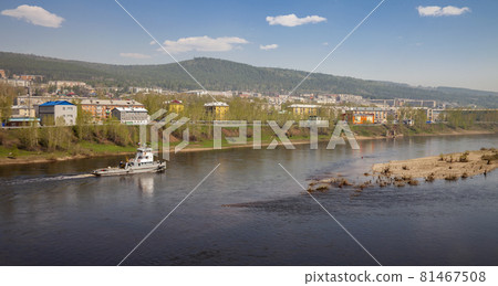 Lena River and the city of Ust-Kut in summer in sunny weather. Lena River and the city of Ust-Kut in summer in sunny weather. 81467508