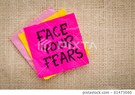 Face your fears advice on sticky note Face your fears advice on sticky note 81473080