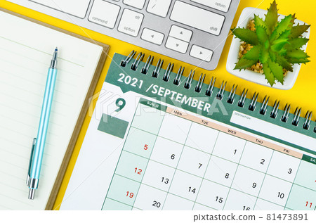 September 2021 desk calendar and diary with keyboard computer. 81473891