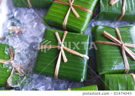 traditional Thai style packaging , Homemade tofu wrapped in banana leaf with natural string traditional Thai style packaging , Homemade tofu wrapped in banana leaf with natural string 81474045
