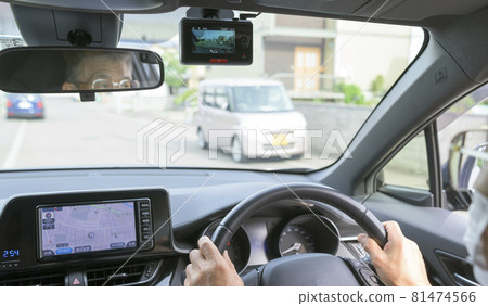 Senior driving a car with a drive recorder Senior driving a car with a drive recorder 81474566