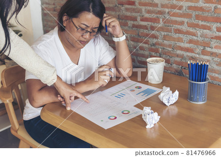 Asian businesswoman overworked at office stressful anxiety with serious problems. Woman exhaustion depress and mental burnout feeling tired frustrate at company office. Stress sadness contemplation 81476966