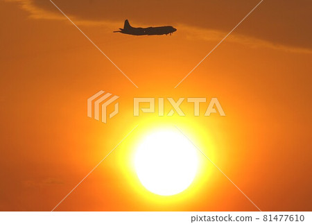 Maritime Self-Defense Force P-3C Orion patrol aircraft flying in a beautiful sunset 81477610