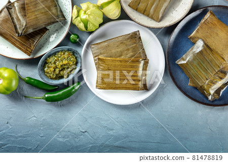 Tamale, traditional dish of the cuisine of Mexico, wrapped in green leaves 81478819