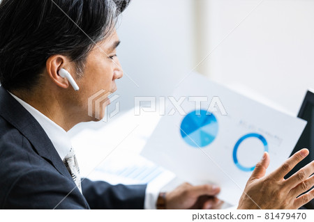 Businessmen attending remote meetings Businessmen attending remote meetings 81479470