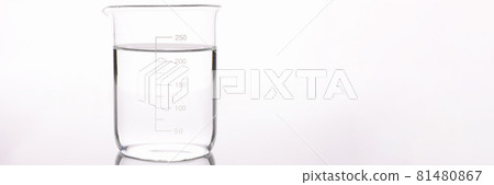 Sterilized water is poured into measuring glass closeup Sterilized water is poured into measuring glass closeup 81480867
