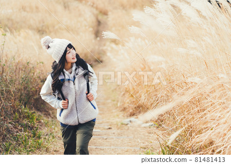 A woman trekking 81481413