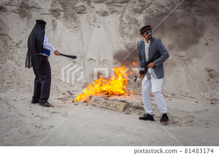 Afghan terrorists destroy music with fire. 81483174
