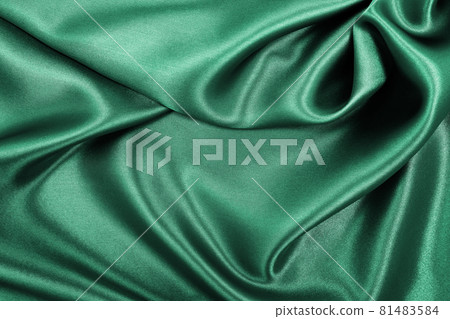 Smooth elegant green silk or satin luxury cloth texture as abstract background. Luxurious background design 81483584