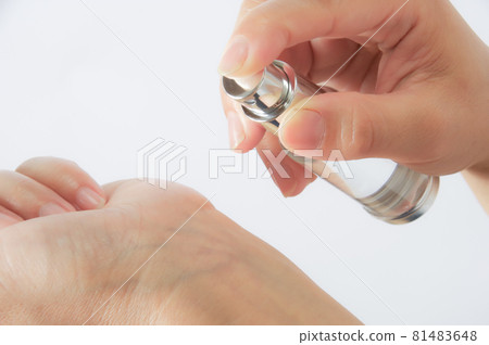 Woman spraying on wrist 81483648