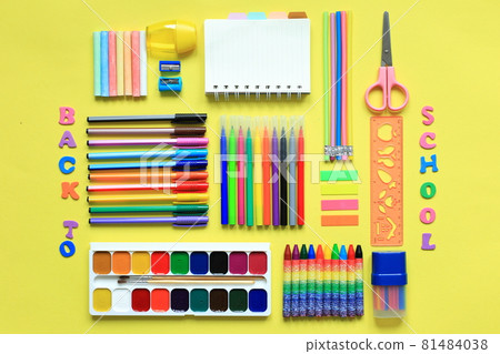 Painting supplies on a colored background. Set of first grader on a yellow background. Office supplies in a layout on a yellow paper background. Flat layout Painting supplies on a colored background. Set of first grader on a yellow background. Office supplies in a layout on a yellow paper background. Flat layout 81484038