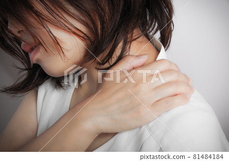 A woman with stiff shoulders A woman with stiff shoulders 81484184