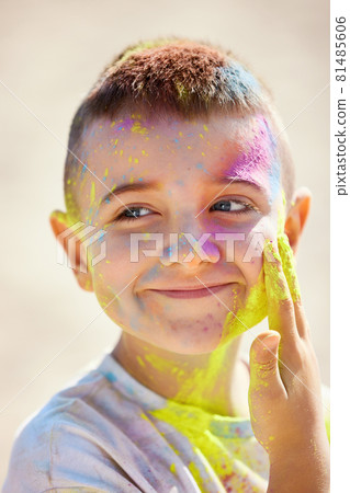 Portrait of happy little child girl in holly paints 81485606