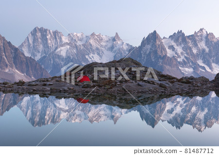 Red tent on Lac Blanc lake 81487712
