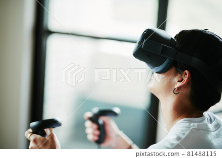 A man playing a virtual reality game 81488115
