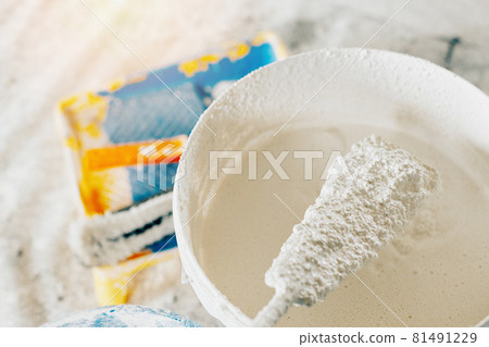 The concept of repair of the house and premises. Buckets of paint and lime for whitewashing and The concept of repair of the house and premises. Buckets of paint and lime for whitewashing and 81491229