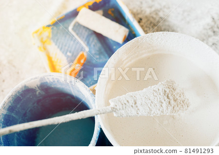 The concept of repair of the house and premises. Buckets of paint and lime for whitewashing and 81491293