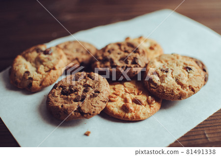 Chocolate cookies on wooden table. Chocolate chip cookies shot. Homemade food on wooden background 81491338