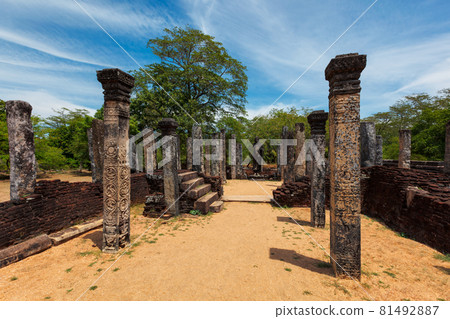 Stainding Buddha statue in ancient ruins 81492887