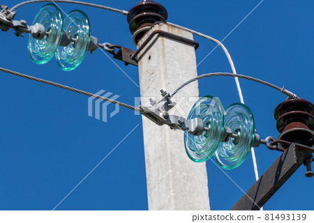 Overhead power transmission towers with ceramic and glass line insulators Overhead power transmission towers with ceramic and glass line insulators 81493139