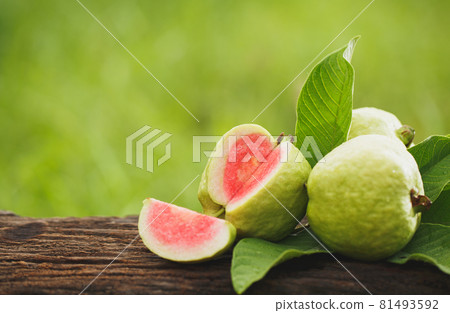 Guava sliced on wood 81493592
