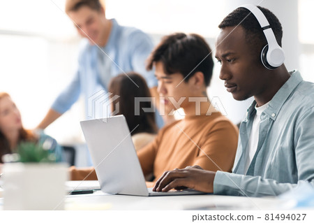 Colleagues working on a project using technology 81494027