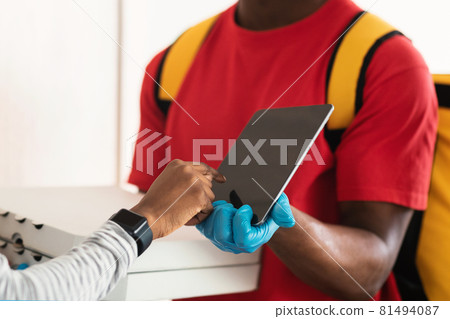 Lady Scanning Fingerprint On Digital Tablet Receiving Pizza Indoor, Cropped Lady Scanning Fingerprint On Digital Tablet Receiving Pizza Indoor, Cropped 81494087