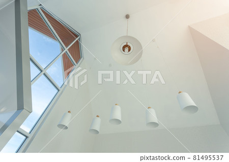 looking up on suspended ceiling with halogen spots lamps and drywall construction in empty room in apartment or house. looking up on suspended ceiling with halogen spots lamps and drywall construction in empty room in apartment or house. 81495537