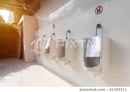 Social distance in washroom urinal. Covid 19 poster for washroom and toilet. Social distance in washroom urinal. Covid 19 poster for washroom and toilet. 81495551